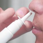 Man uses a nasal spray