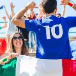 Happy Italian fans at stadium for soccer match