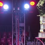 Artist balancing on rings in the circus