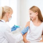 doctor doing vaccine to child in hospital